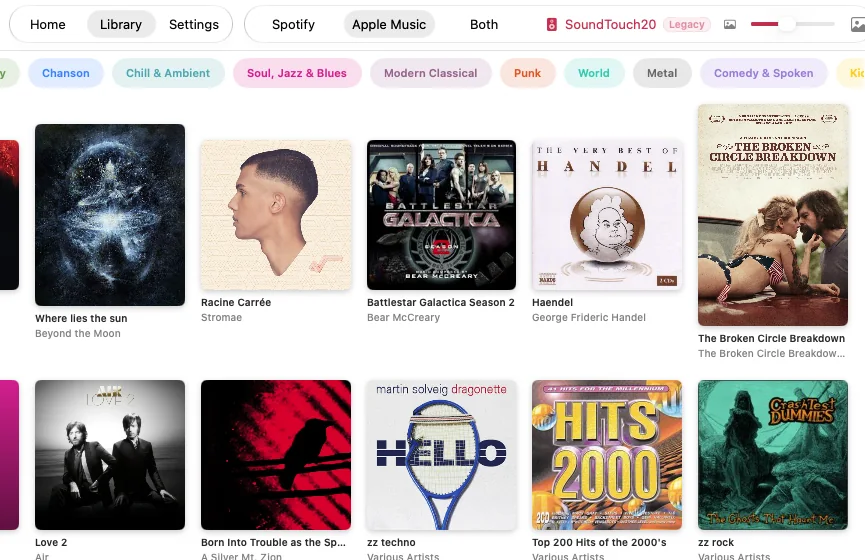 alSpot on the Mac: a grid of album covers with genre buttons and a speaker picker